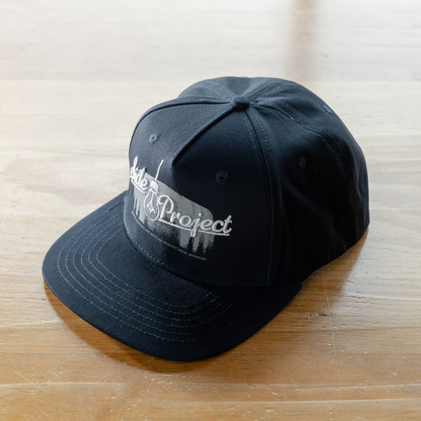 Side Project Logo with Barrel Navy Hat