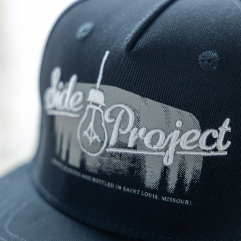 Side Project Logo with Barrel Navy Hat